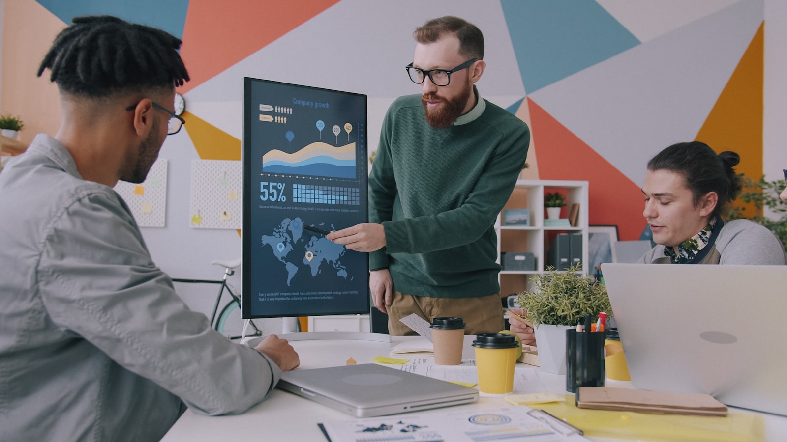 Specialist reviewing analytical market information on screen.